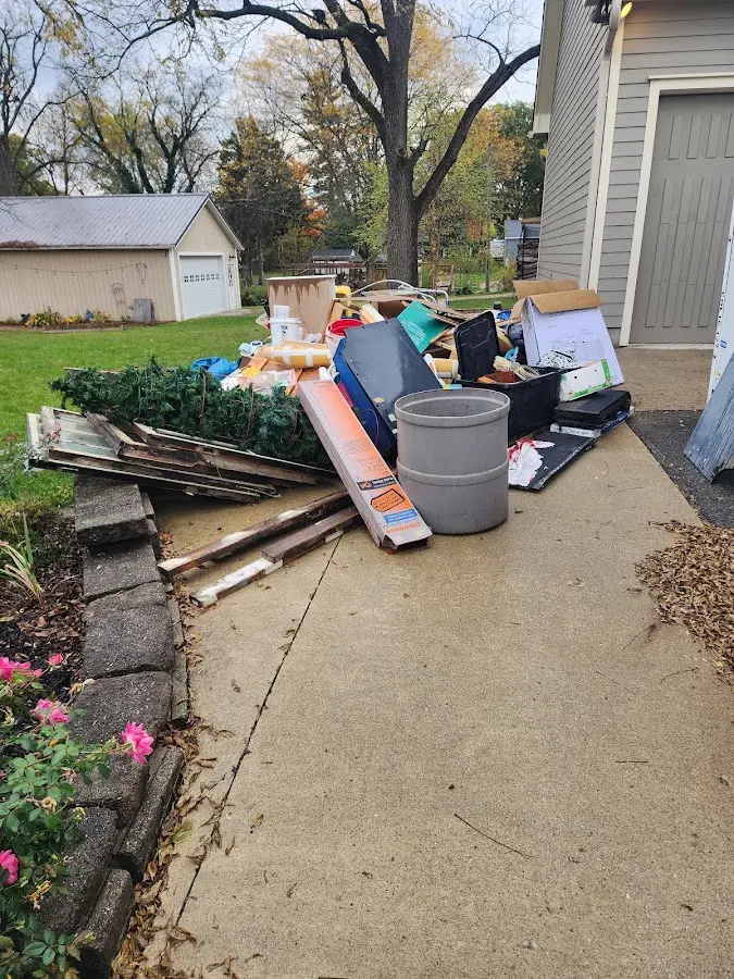 Dumpster being loaded with debris for Estate Cleanout Dumpster Rental in Voorhees